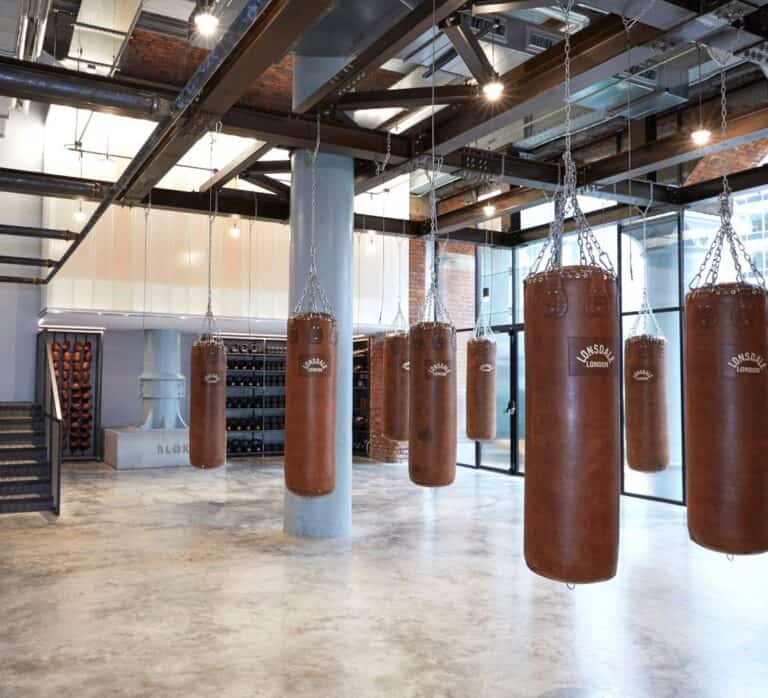 Hanging punching bags from the wall at Manchester based gym Blok