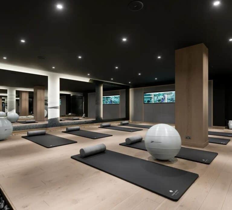 Yoga mats in a dimly lit studio space at Gsquared Gym