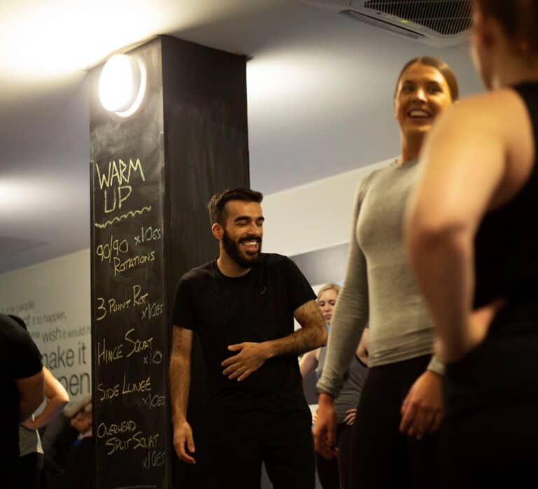 People laughing at a fitness class by M3 Perform Manchester