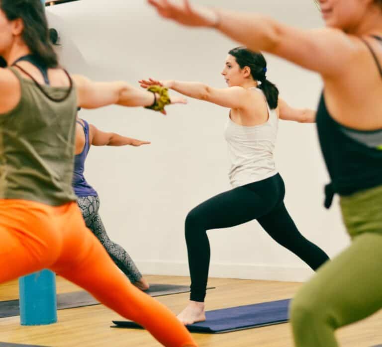 People doing yoga poses at Yoga Soul studio in Manchester