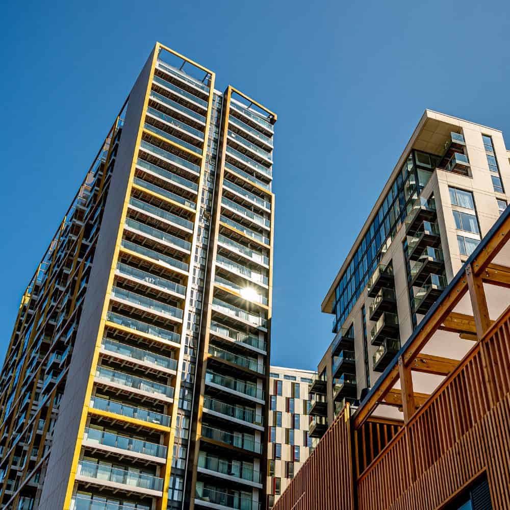 Upward view of Elephant Central apartment buildings on a blue sky day