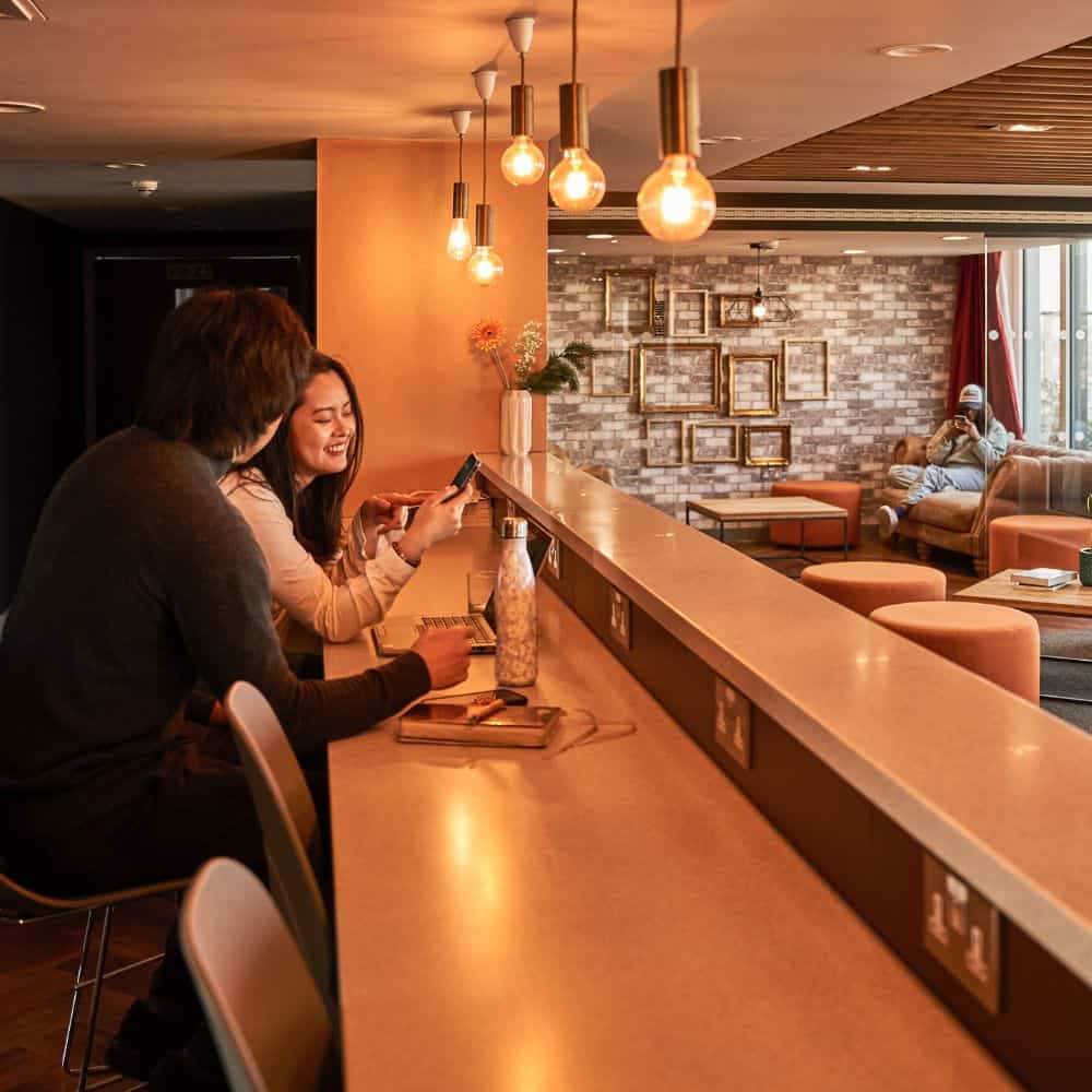 Students sat in the communal Skylounge amenity area at Portchester House student accommodation in London